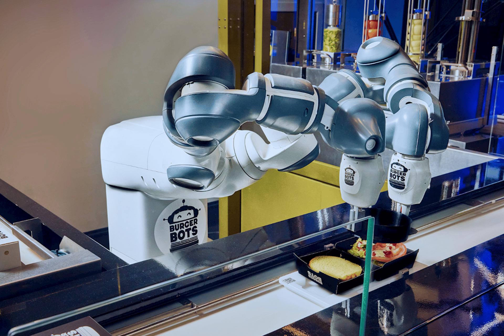 Ajouter des graphismes adorables à un robot donne vraiment l'impression qu'il est ravi de préparer votre burger