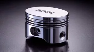 Illustration de l'innovation de Ferrari avec des pistons oblongs pour améliorer l'efficacité des moteurs.
